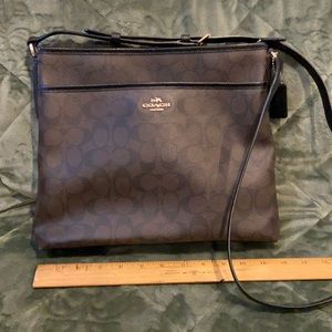 A Coach shoulder purse. 11” X 11”